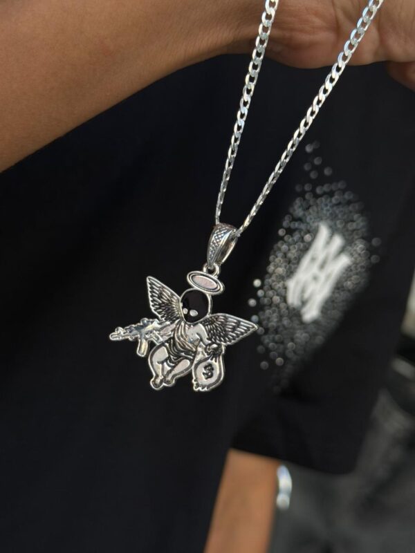 DIJE ANGEL CON PISTOLA Y BOLSA DOLAR PLATA 925 (8,63GR)
