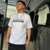 POLERA REBELLION CRUZ CON BRILLO ROSA WHITE OVERSIZE