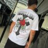 POLERA REBELLION CRUZ CON BRILLO ROSA WHITE OVERSIZE