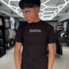 POLERA RESTRICTED NEGRA - ESTATUA DE LA LIBERTAD NIÑO BRILLANTE ORIGINALS