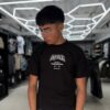 POLERA M Y M NEGRA BRILLANTE NIÑO