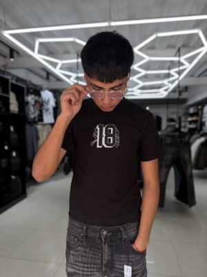 WhatsApp Image 2026-05-20 at 1.47.42 PM POLERA 18 NEGRA ORIGINALS NIÑO