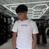 POLERA RESTRICTED BLANCA SLIM FIT NIÑO BRILLO