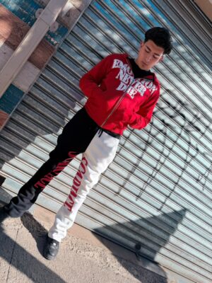 POLERON EMOTION NEVER ME ROJO OVERSIZE