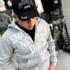 POLERON EMOTION NEVER ME GRIS OVERSIZE