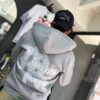 POLERON EMOTION NEVER ME GRIS OVERSIZE